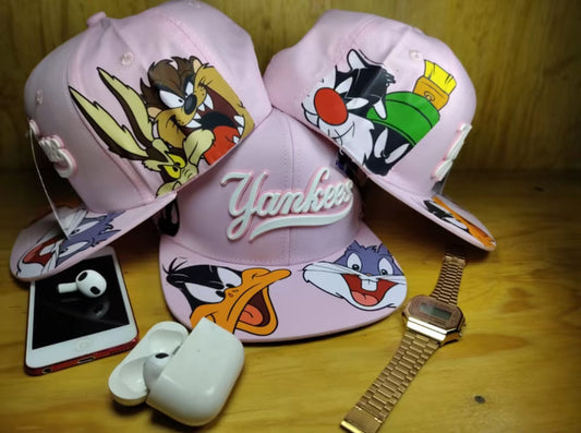 Gorra plana Coleccion Looney Tunes Color Rosa con Diseños de Personajes Favoritos y Logotipo
Goma